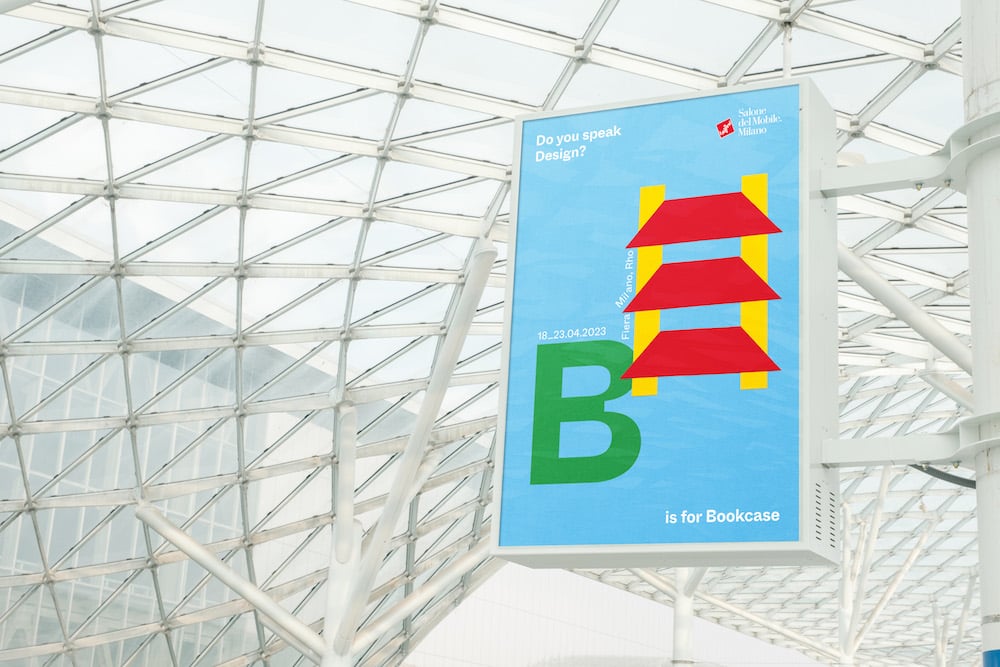 Pop-Art-Kampagne für den Salone del Mobile: B is for Bookcase. Plakat unter einer Glaskuppel