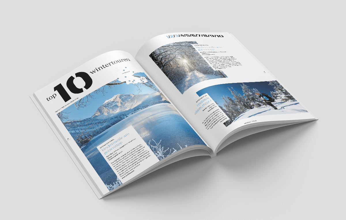 Eine Magazin Doppelseite, die die »Top 10 Wanderstrecken¡ mit Bildern einer verschneiten Landschaft zeigt