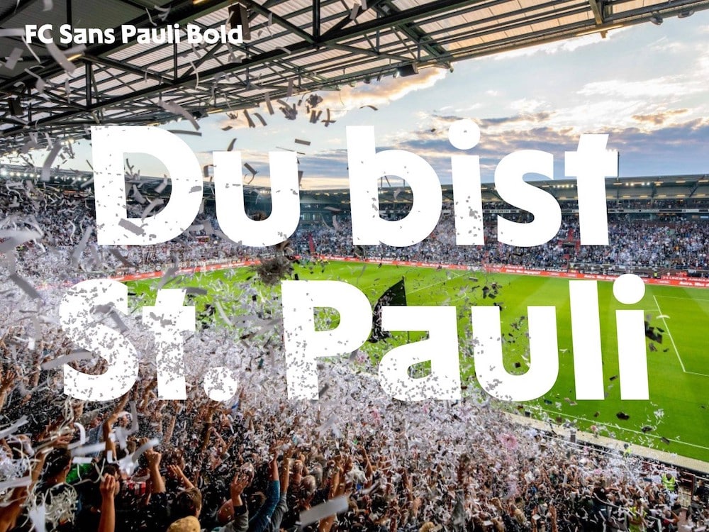 Stolzer Linksdrall: Karl Anders launcht Schrift für den Kultclub FC St. Pauli: Millerntorstadion mit FC Sans Pauli in Weiß vorne auf dem Bild und dort steht: Du bist St. Pauli