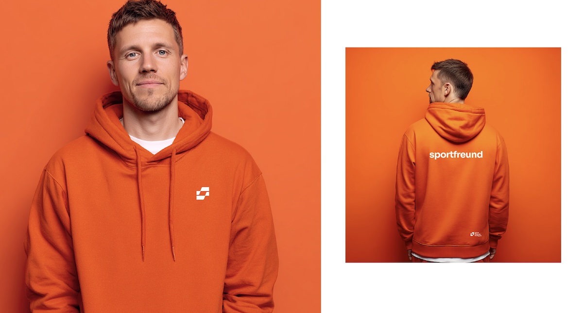 Merchandise Hoodie sport freunde stuttgart in Orange, die junger Mann trägt