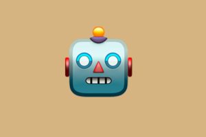 Roboter Emoji auf sandfarbenem Hintergrund